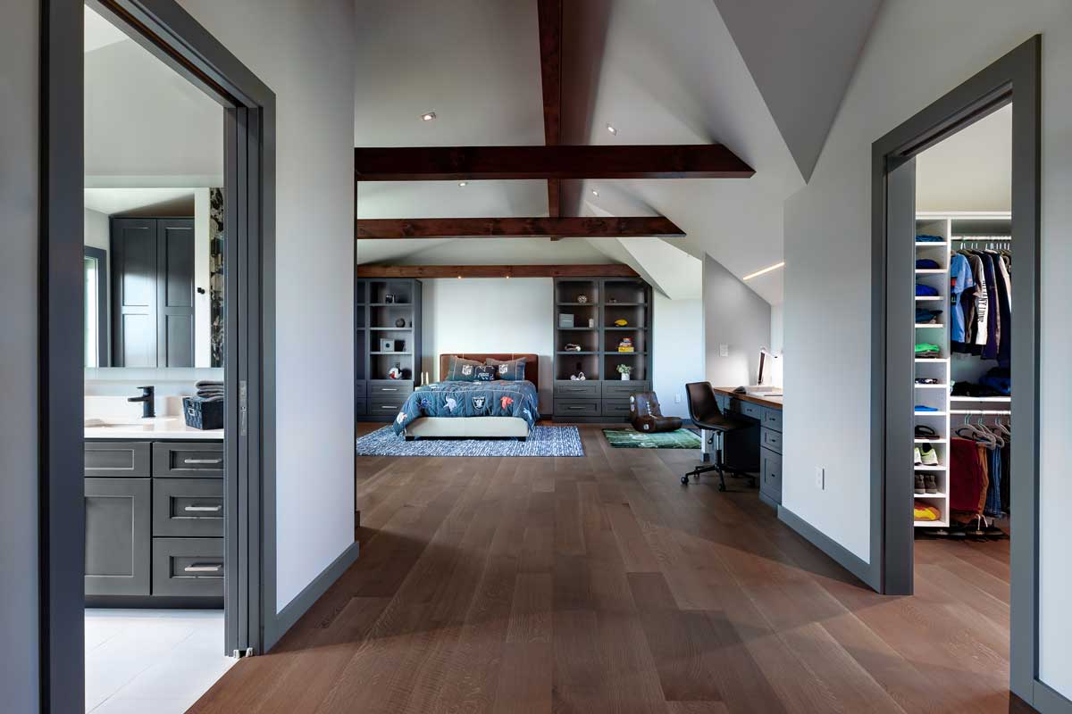 Contemporary bedroom in log home renovation