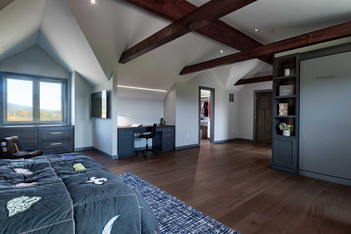 Contemporary bedroom in log home renovation