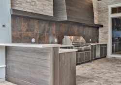 NatureKast - Outdoor Kitchen with Custom Hood and Raised Bar